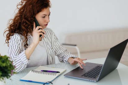 beautiful-businesswoman-working-projects-young-businesswoman-talking-phone-office-desk_231208-14199
